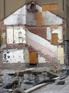 a building bearing the imprint of what was once the adjoining building, or house